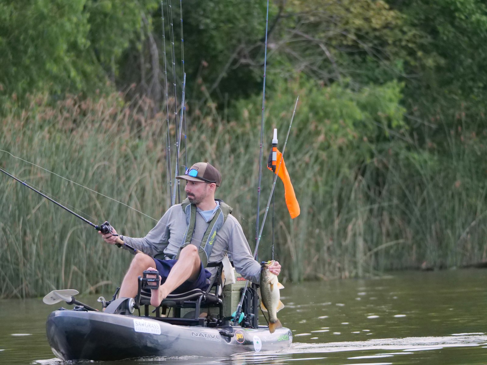 Kayak angler with a bass